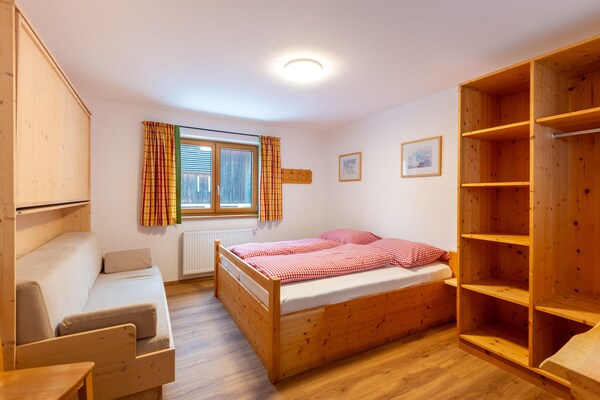 Foto van Boerderij in Bramberg met Natuurlijke Vijver - Vakantiehuis in Bramberg - BedRoom