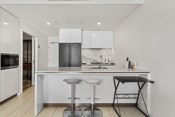 Foto van Stijlvol appartement met 2 slaapkamers in het centrum van Zuid-Brisbane - Kitchen