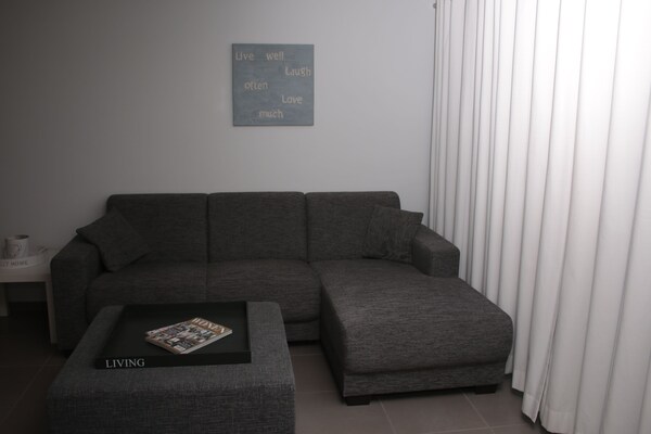 Foto van Prachtig vakantiehuis in Adinkerke met een omheind terras - LivingRoom