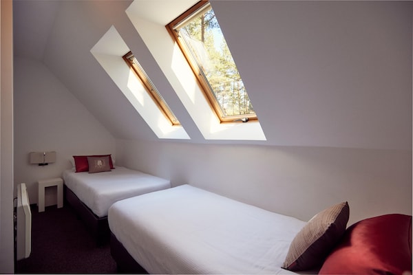Foto van Twee-onder-een-kapwoningen in het natuurresort Drewitz - BedRoom