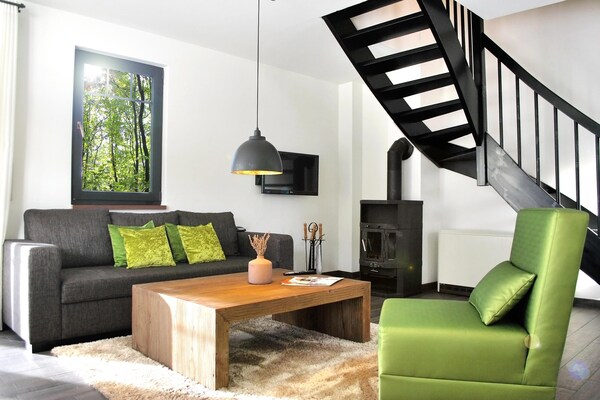 Foto van Twee-onder-een-kapwoningen in het natuurresort Drewitz - LivingRoom