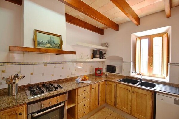 Foto van Landhuis Porto Cristo met zwembad en tuin - Vakantiehuis in Manacor - Kitchen