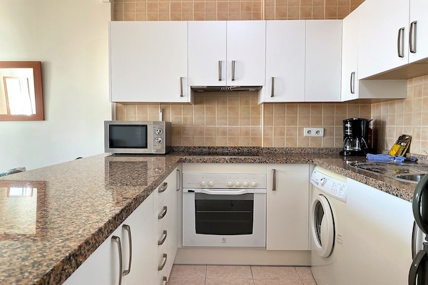 Foto van Appartement aan het strand in Nerja met zwembad - Vakantiehuis in Nerja - Kitchen