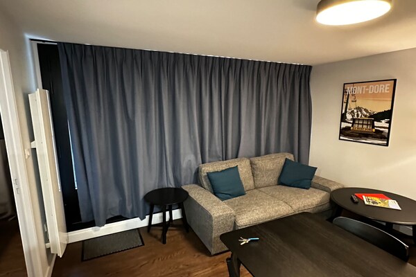 Foto van Verblijf voor 4 met balkon en uitzicht op het bos - Vakantiehuis in Mont-Dore - LivingRoom