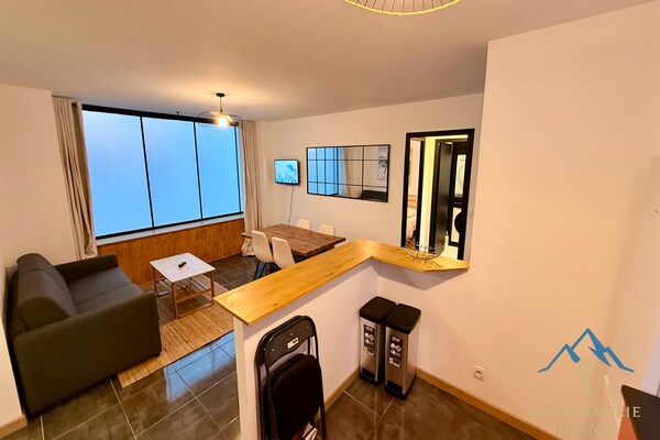 Foto van Moderne hoek bij de centrale doorgang - Vakantiehuis in Mont-Dore - LivingRoom