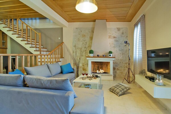 Foto van Panormo Seaside Stay met open haard - Vakantiehuis in Panormo - LivingRoom