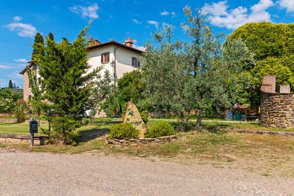 Foto van Landelijk huis in Arezzo met zwembad - Vakantiehuis in Tregozzano, Arezzo - ExteriorSummer