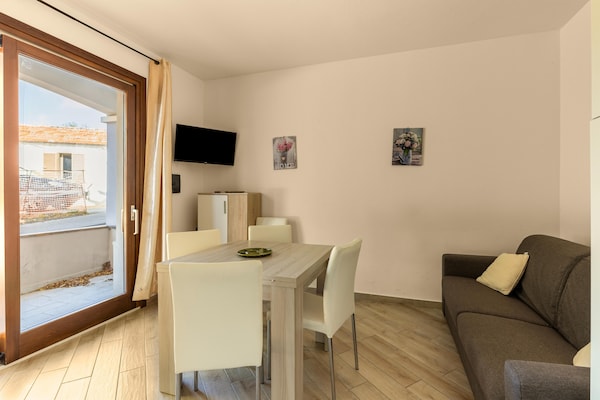 Foto van Airconditioning, tuin en eigen parkeerplaats - Vakantiehuis in Badesi - LivingRoom