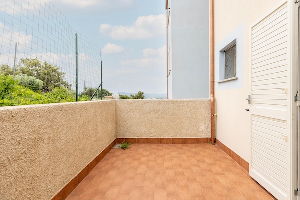Foto van Zwembad condivisa en giardino privato - Vakantiehuis in Badesi - TerraceBalcony