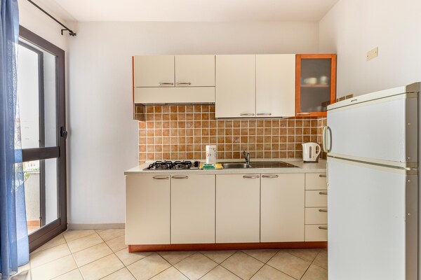 Foto van Appartamento vicino al mare, 2 zwembaden - Vakantiehuis in Valledoria - Kitchen