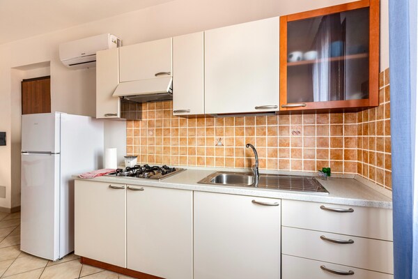 Foto van Appartamento vicino al mare, 2 zwembaden - Vakantiehuis in Valledoria - Kitchen