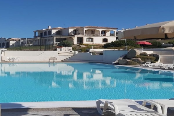 Foto van Appartement met zeezicht en een dakterras - Vakantiehuis in Santa Teresa Gallura - ExteriorSummer