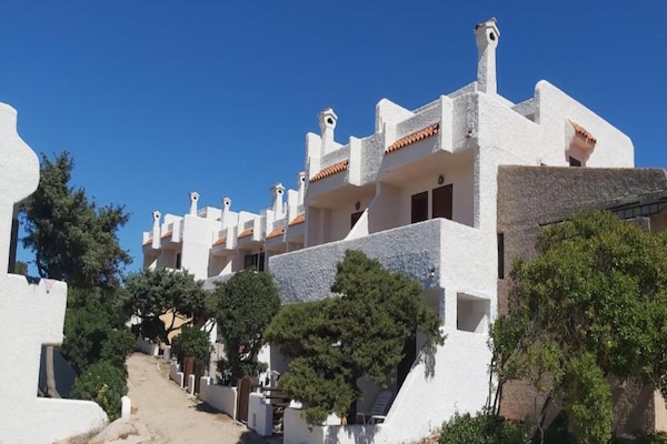 Foto van Appartement met zeezicht en een dakterras - Vakantiehuis in Santa Teresa Gallura - ExteriorSummer
