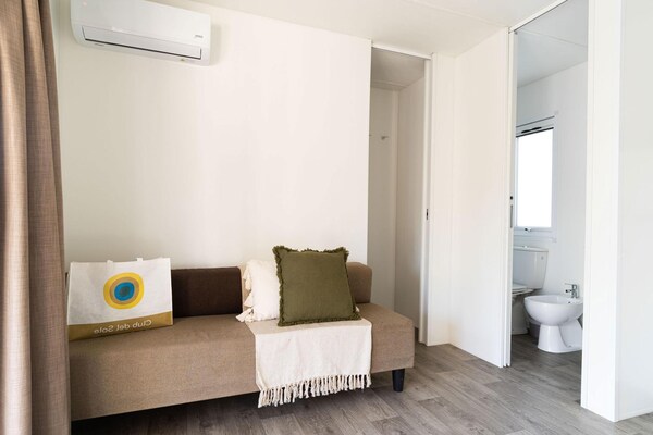 Foto van Lodge in het familiedorp Rimini vlakbij het strand - LivingRoom