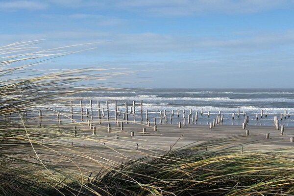 Foto van Moderne bungalow dichtbij het strand met uitzicht - Vakantiehuis in Sint Maartensvlotbrug - AreaSummer5KM