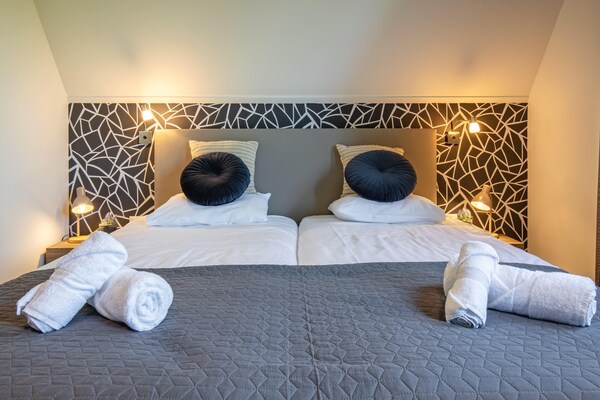 Foto van Heerlijke villa aan de bosrand - Vakantiehuis in Den Burg - BedRoom