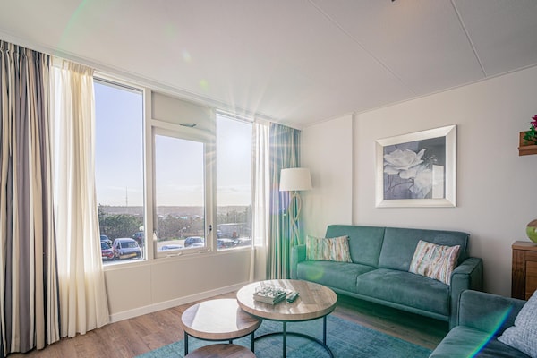 Foto van 4 Persoons appartement met eilandzicht - Vakantiehuis in De Koog - LivingRoom