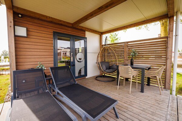 Foto van Huisdiervriendelijk verblijf in een lodge - Vakantiehuis in Maurik - TerraceBalcony