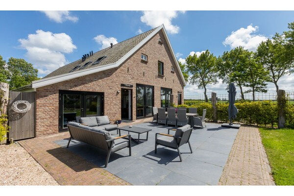 Foto van Landhuis in Vrouwenpolder bij Strand - Vakantiehuis in Vrouwenpolder - TerraceBalcony