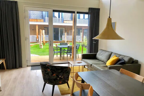 Foto van 4-persoons lodge in tiny house stijl. - Vakantiehuis in Zoutelande - LivingRoom