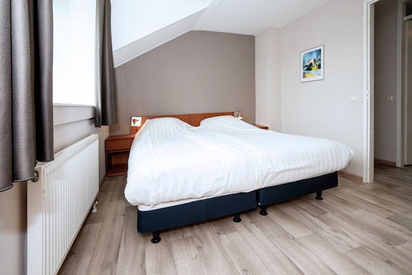 Foto van Havenwoning met fantastisch uitzicht - Vakantiehuis in Heel - BedRoom