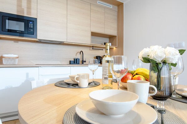 Foto van Appartement met uitzicht op de rivier, zwembad. - Vakantiehuis in Dziwnow - DiningRoom