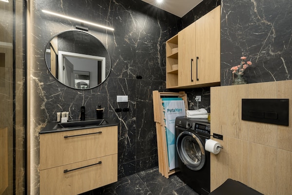 Foto van Appartement met uitzicht op de rivier, zwembad - Vakantiehuis in Dziwnow - BathRoom